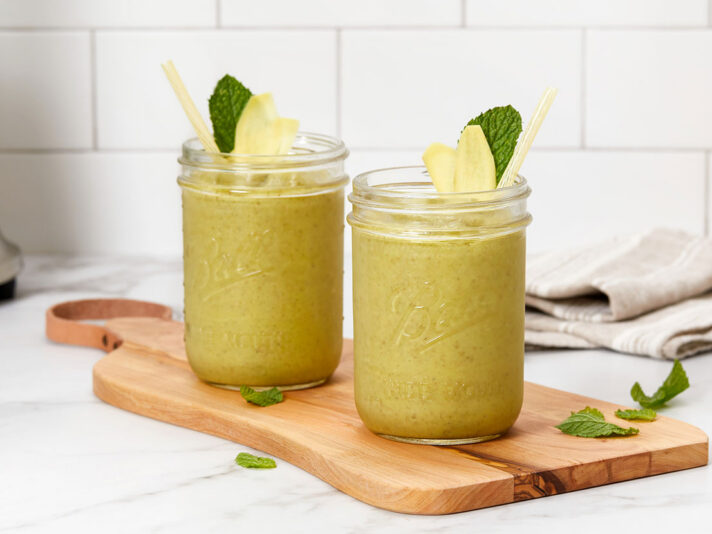 An image of prepared Healthy Greens Breakfast Smoothie made with V8® Deliciously Green 100% Fruit and Vegetable Juice, pineapple, avocado and chia seeds.