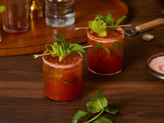 An image of prepared Light and Crisp Bloody Mary made with basil, ginger, V8® 100% Vegetable Juice, cucumber vodka, lime juice and seltzer water.