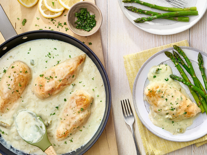 An image of prepared Lemon Asparagus Chicken made with chicken, Campbell's® Condensed Cream of Asparagus Soup, milk and lemon juice.