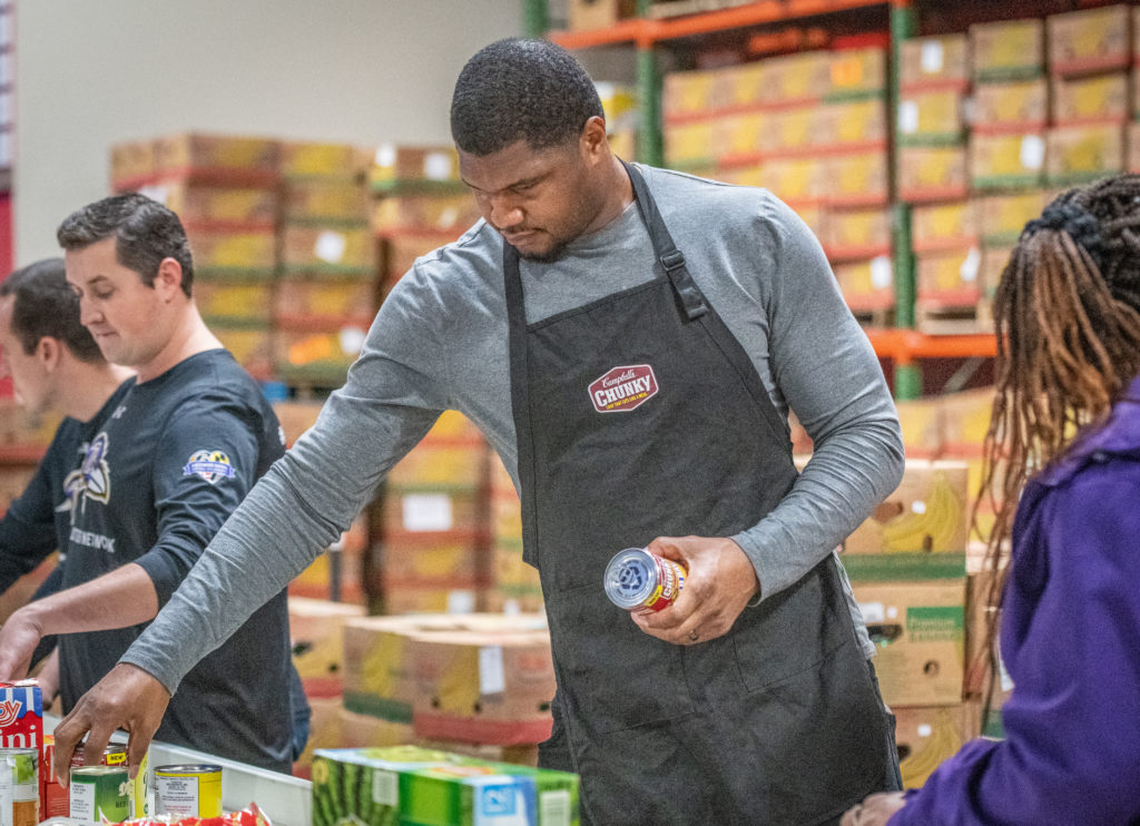 Ravens Defensive Lineman Calais Campbell and his mom, Nateal, on Monday, Nov. 28, 2022, in Baltimore with Campbell's Chunky. Calais, in partnership with the Ravens and Chunky donated 100,000 meals today at the Maryland Food Bank, as part of the brand's community program, Chunky Sacks Hunger. (Edwin Remsberg/AP Images for Campbell's Chunky)
