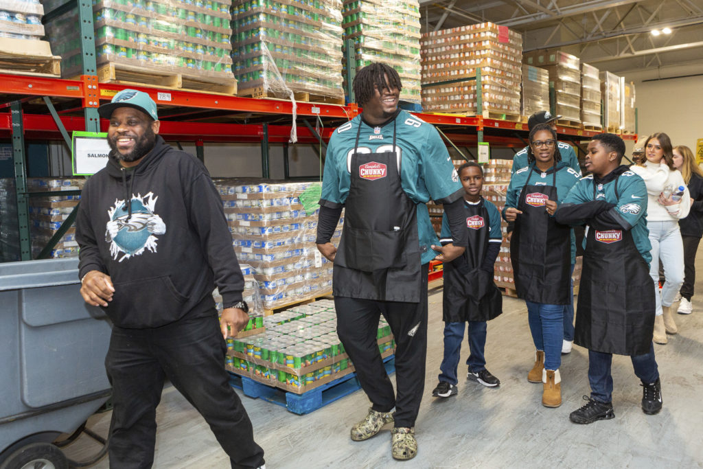 IMAGE DISTRIBUTED FOR CAMPBELL'S CHUNKY - Eagles Defensive Tackle Jordan Davis on Tuesday, December 13, 2022 in Philadelphia with Campbell's Chunky. Jordan, in partnership with the Eagles and Chunky donated 100,000 meals today at Philabundance, as part of the brand's community program, Chunky Sacks Hunger. (Mark Stehle/AP Images for Campbell's Chunky)