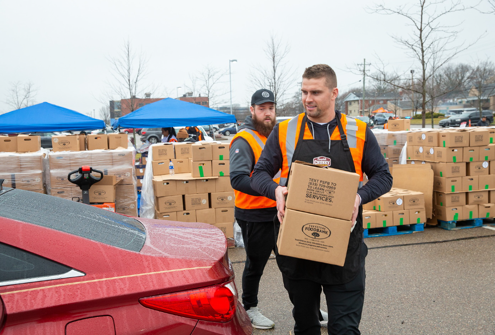 Sam Hubbard helped sack hunger ahead of the holidays through a drive-thru meal donation event with Chunky Sacks Hunger, Bengals teammates, and the Freestore Foodbank.