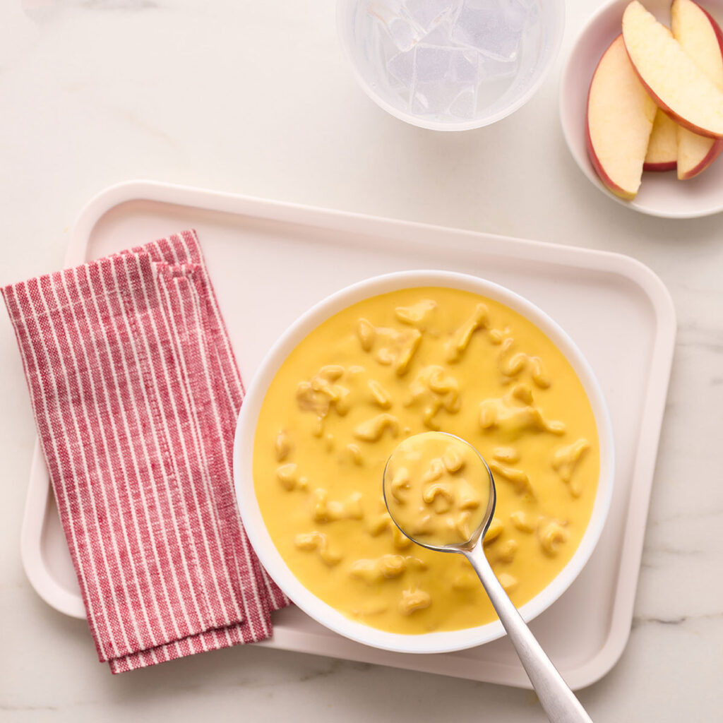 An image of prepared Campbell's® Condensed Cheddar Cheesy Noodle Soup. 
