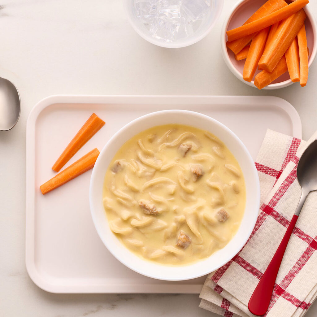 An image of prepared Campbells® Condensed Kids Creamy Chicken and Twists Soup.