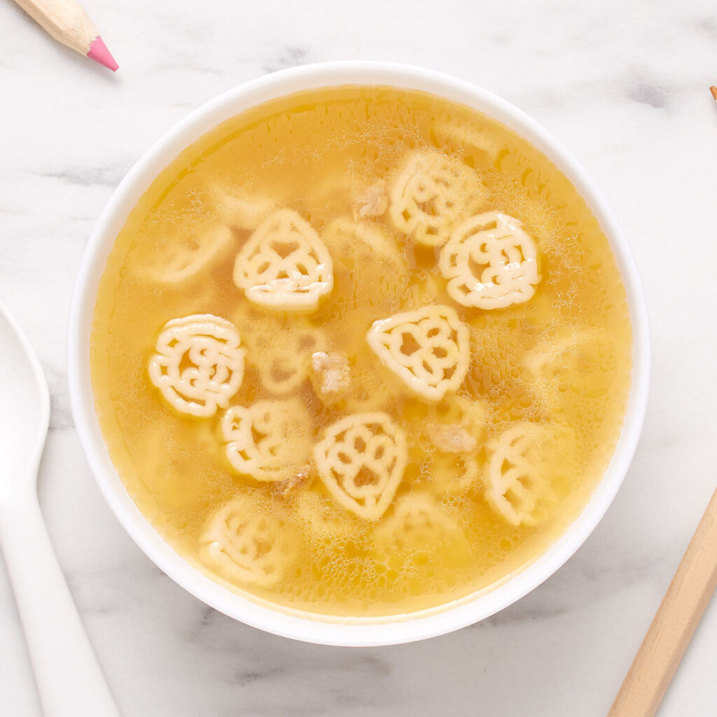 An image of prepared Campbells® Condensed Paw Patrol® Awesome Shapes Pasta Soup with Chicken in Chicken Broth.